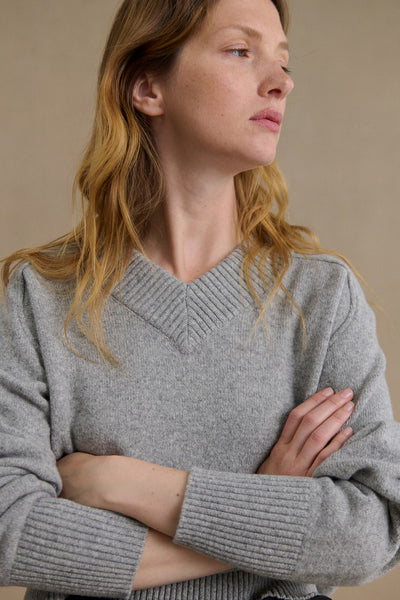 Women's light grey V-neck sweater